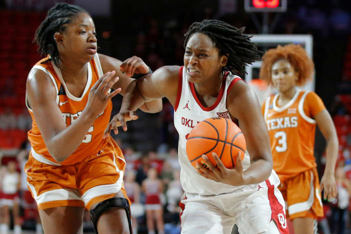 Oklahoma Sooners guard Madi Williams (25) goes past Texas Longhorns forward DeYona Gaston (5) during a women's college basketball game between the University of Oklahoma Sooners (OU) and the Texas Longhorns at Lloyd Noble in Norman, Saturday, Jan. 29, 2022. Oklahoma won 65-63. Ou Women Vs Texas